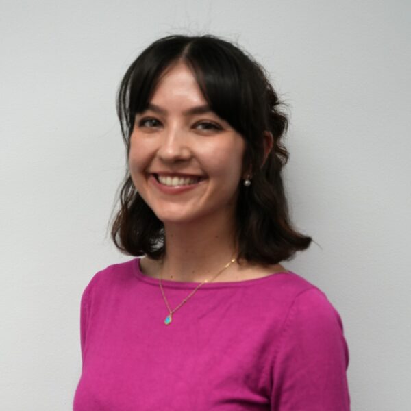 Kathleen Blackburn wearing a pink shirt, smiling.