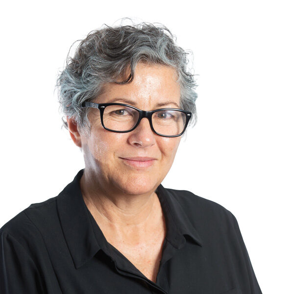 Jill Rundle who has grey curly hair and is wearing glasses