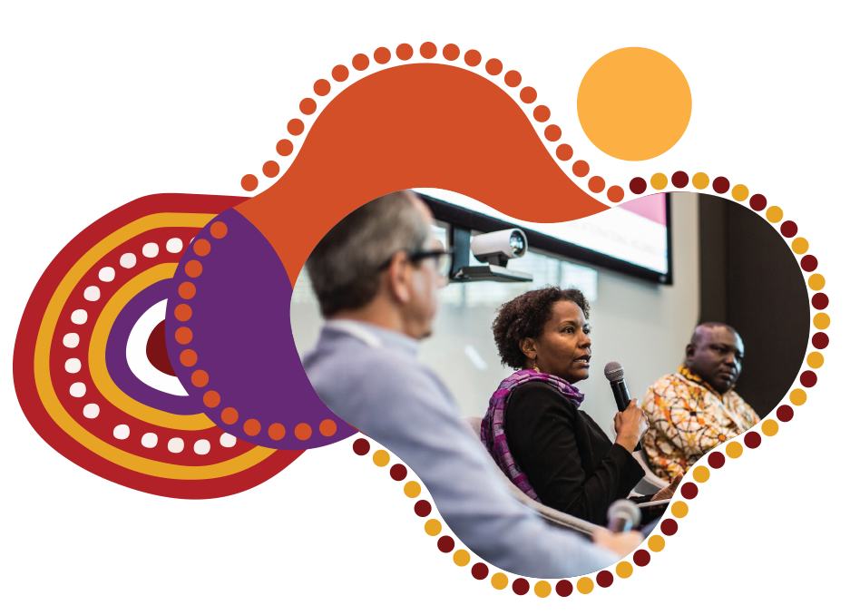 Orange, yellow and purple circles surround a photo of a man from behind sitting and watching a conference presentation.